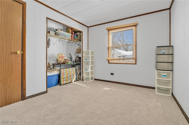 bedroom featuring ornamental molding and light colored carpet