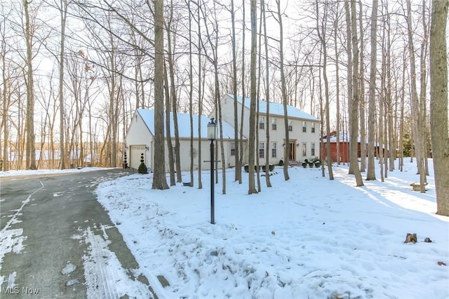 exterior space with a detached garage