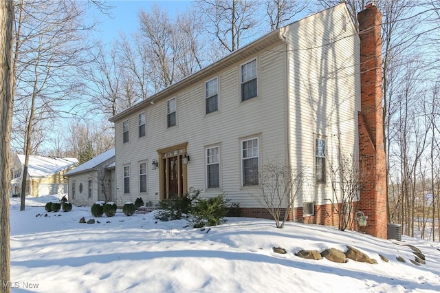 view of front of home with a chimney