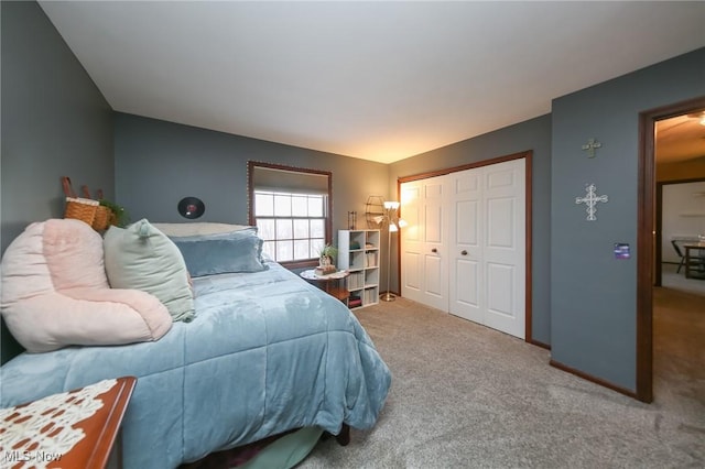 carpeted bedroom featuring a closet