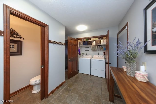 laundry room featuring washing machine and clothes dryer