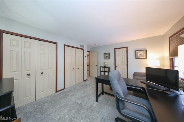 home office featuring light colored carpet