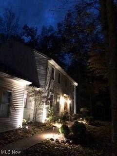 view of property exterior at twilight