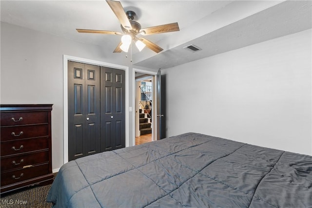 bedroom featuring ceiling fan and a closet