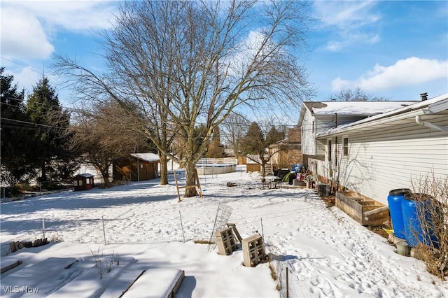 view of yard covered in snow