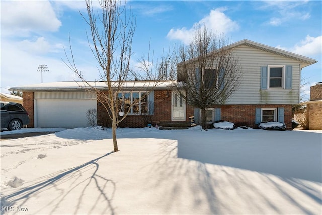 split level home with a garage