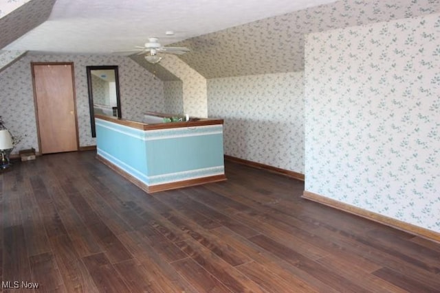 additional living space with dark wood-type flooring, ceiling fan, and lofted ceiling