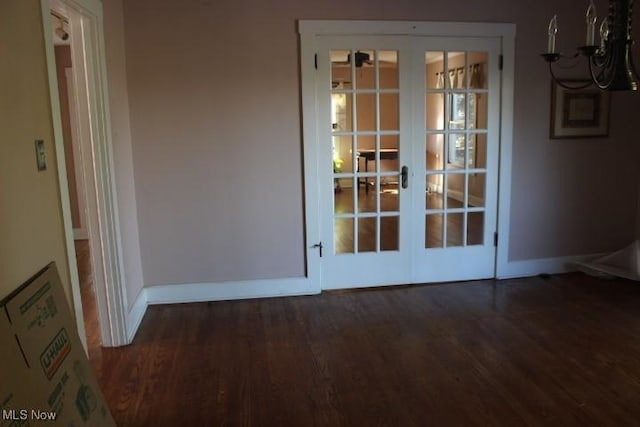 interior space with dark wood-type flooring and french doors