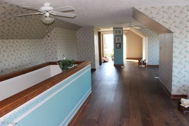 interior space featuring dark hardwood / wood-style floors and a textured ceiling