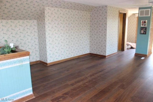 empty room featuring dark hardwood / wood-style floors