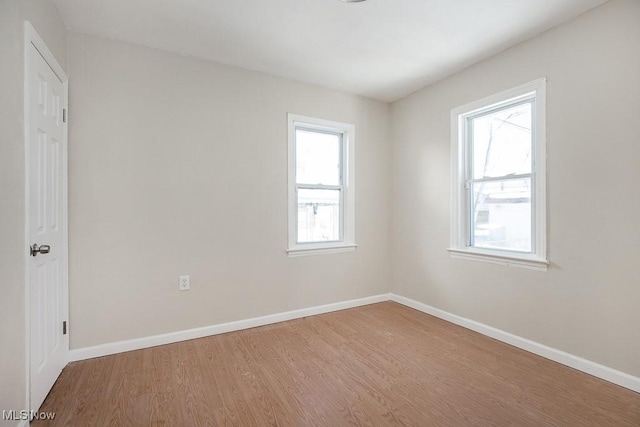 unfurnished room featuring wood-type flooring