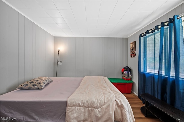 bedroom with hardwood / wood-style floors