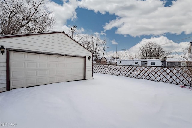 view of snow covered garage