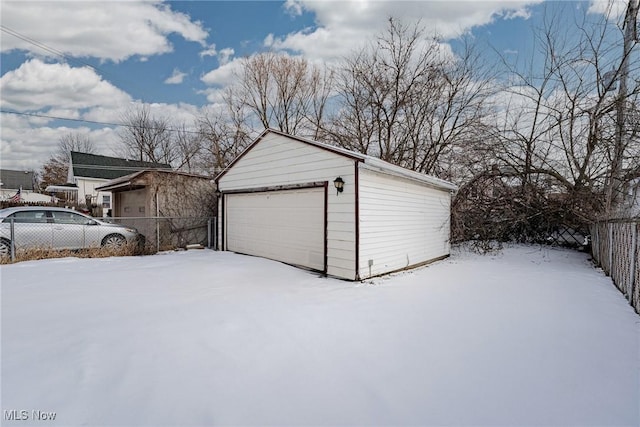 view of snow covered garage