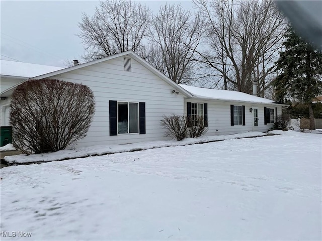 view of snow covered house