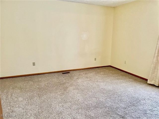 unfurnished room with carpet