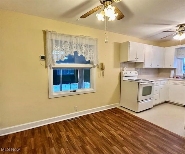 kitchen featuring white cabinetry, electric range, hardwood / wood-style flooring, ceiling fan, and decorative backsplash