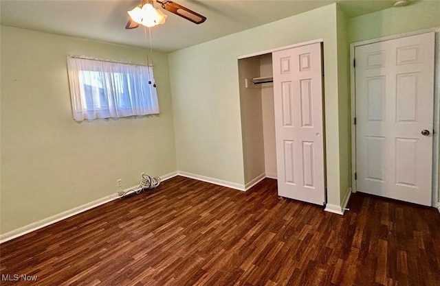 unfurnished bedroom featuring dark wood-type flooring and ceiling fan