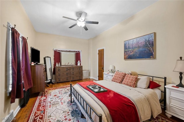 bedroom with hardwood / wood-style flooring and ceiling fan