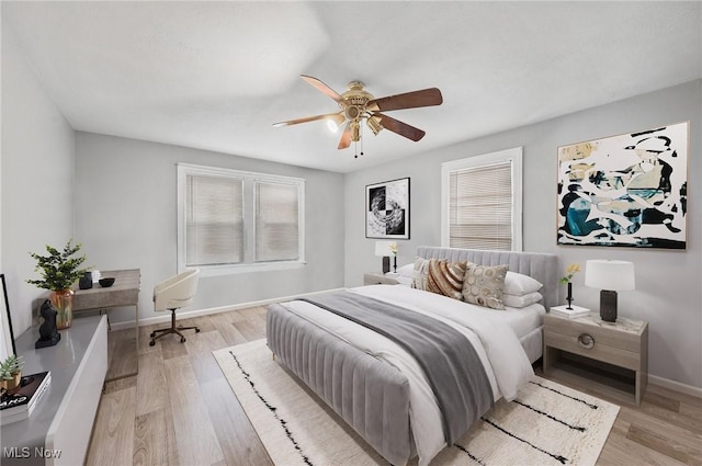 bedroom featuring light hardwood / wood-style flooring and ceiling fan