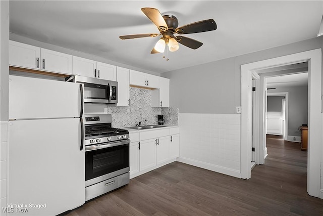 kitchen featuring white cabinetry, sink, dark hardwood / wood-style flooring, and stainless steel appliances