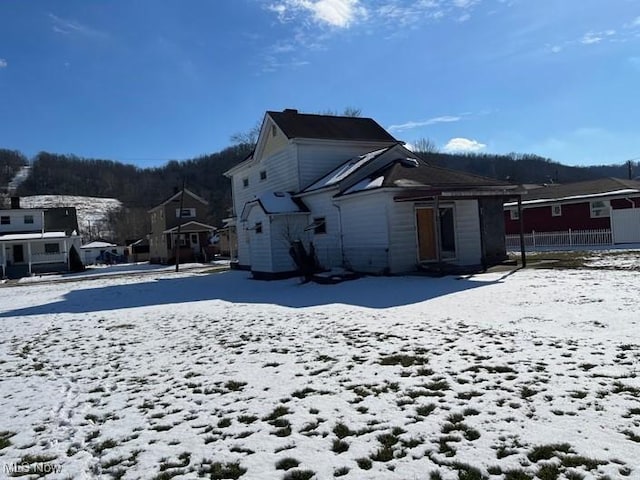 view of snow covered house