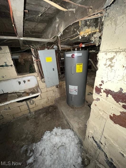 utility room featuring electric water heater and electric panel