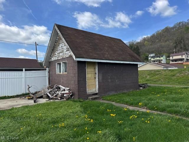 83 Watson St, Dillonvale, OH 43917 - view of outbuilding with fence and an outdoor structure