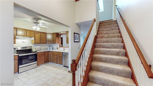 kitchen with ceiling fan, appliances with stainless steel finishes, and sink