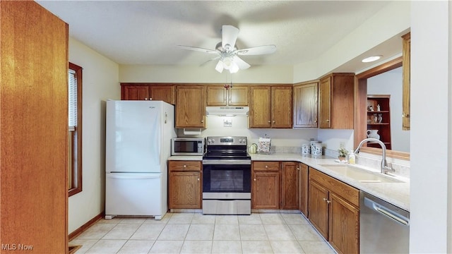 kitchen featuring ceiling fan, appliances with stainless steel finishes, and sink