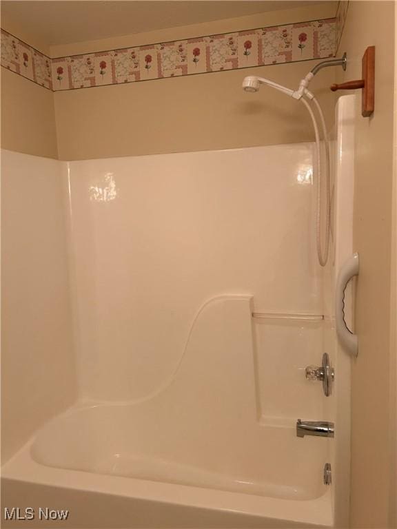 bathroom with shower / tub combination