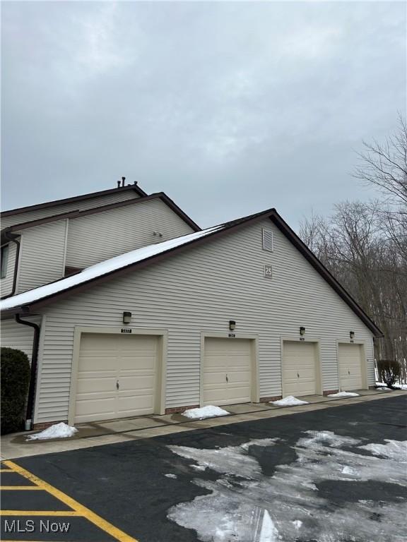 view of side of property featuring a garage