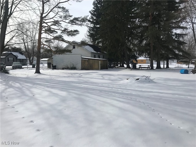 view of yard covered in snow