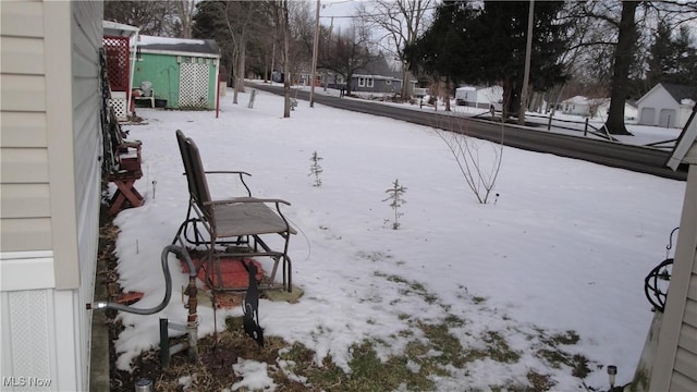 view of yard covered in snow