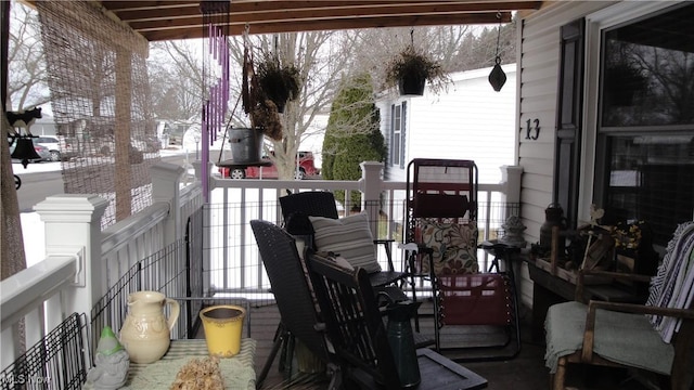 view of snow covered back of property