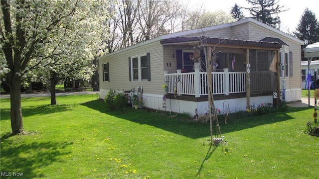 13 Cherokee, Creston, OH 44217 - manufactured / mobile home with a porch and a front yard