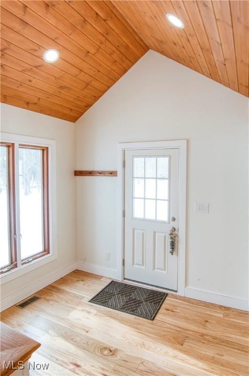 interior space with lofted ceiling and light wood-type flooring