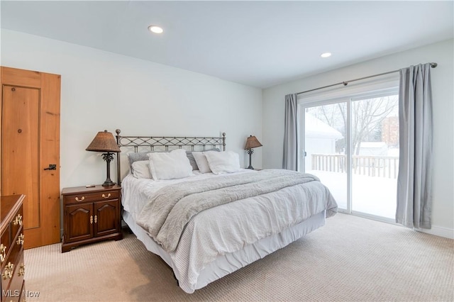 carpeted bedroom featuring access to exterior