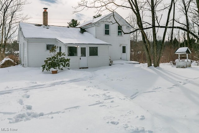 view of snow covered house