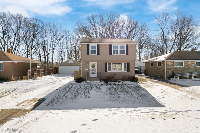 view of front property featuring a garage and an outdoor structure