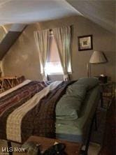 bedroom featuring lofted ceiling