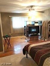 bedroom with hardwood / wood-style flooring and ceiling fan