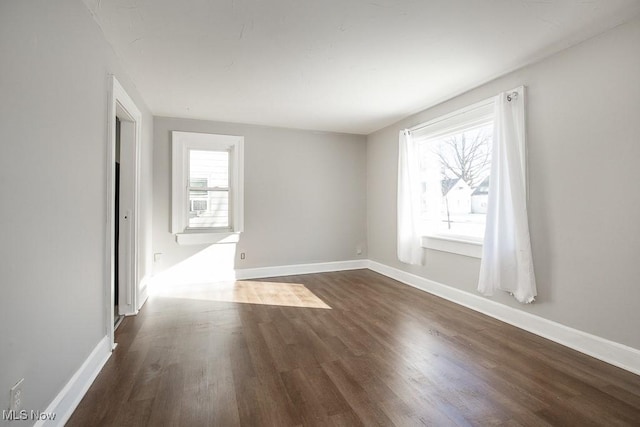 empty room featuring dark hardwood / wood-style floors