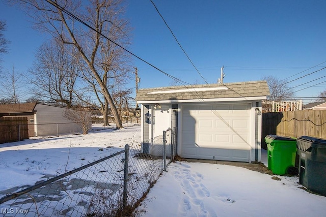 view of snow covered garage