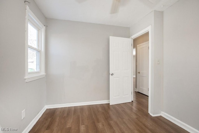 empty room featuring dark hardwood / wood-style flooring