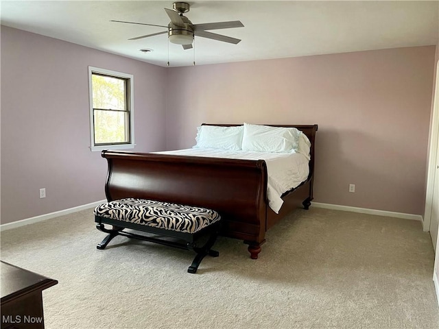 bedroom with ceiling fan and carpet