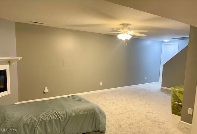 bedroom featuring ceiling fan and carpet flooring