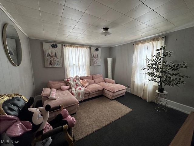 carpeted living room with crown molding