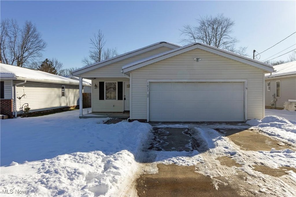 single story home featuring a garage