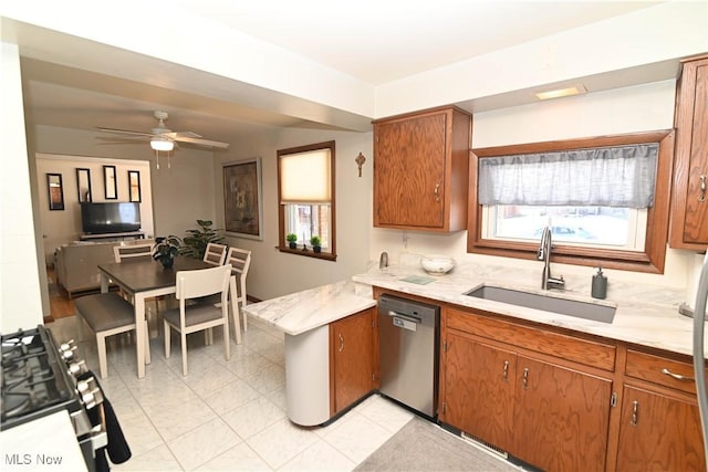 kitchen with sink, stainless steel dishwasher, and ceiling fan